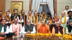 राज्यसभा चुनाव में जीते भाजपा उम्मीदवारों के साथ मुख्यमंत्री योगी आदित्यनाथ और अन्य नेता