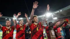 احتفال لاعبي بلجيكا بعد انتهاء المباراة مع البرتغال