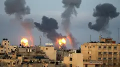 Flames and smoke rise from the Gaza Strip on 11 May 2021