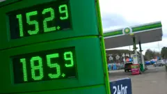 Petrol prices displayed on a digital sign outside a BP petrol station in Guildford.