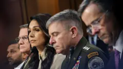 Daraiktera FBI, Kash PAatel, Daariktera Tika Humna Waraanaa Lt Jen. Jeemsi Adams III, Daariktera Tika Biyyaalessaa Tulsii Gabard, Let Jen. Wiiliyaam Hartmaanii fi Daariktera Ejeensii Tika Gidduugaleessaa Joon Raatkiliif yeroo ibsa kennan.