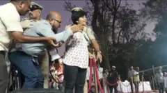 মঞ্চে অমূল্যার মাইক কেড়ে নিচ্ছেন আয়োজকরা।