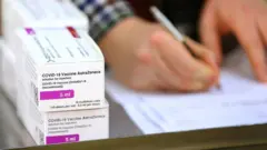 Doses of the Oxford-AstraZeneca Covid-19 vaccine are logged after they arrive at the Princess Royal Hospital in Haywards Heath, West Sussex, on 2 January 2021