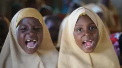 Gap-toothed girls wearing hijab recites Islamic texts in a classroom in a school in Maiduguri, north-eastern Borno state, Nigeria, 07 February 2022.