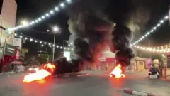 Fires burning in a street