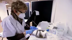 A nurse prepares a dose of the Pfizer-BioNTech COVID-19 vaccine in Cannes, France, 09 January 2021.