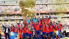 Rodri #16 of Spain lifts the FIFA World Cup Winner’s Trophy after the team’s victory following during the FIFA World Cup 2026 Final match between Spain and Argentina at New York New Jersey Stadium on July 19, 2026 in East Rutherford, New Jersey.