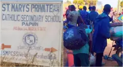 Asambodo njirimaara ụlọakwụkwọ St. Mary's na ụmụakwụkwọ ahụ yi uwe akwụkwọ ha ma nyara akpa n'azụ.