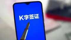 K簽出現在手機屏幕上