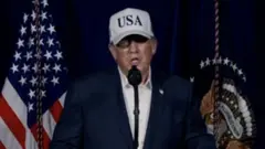 Image of Trump at the podium delivering his speech