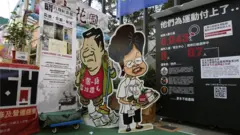 A comical illustration of Chinese President Xi Jinping and Hong Kong leader Carrie Lam