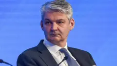 UK National Security Adviser Sir Stephen Lovegrove seen on a stage at a conference