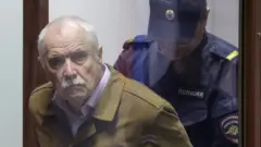 Maslov before he was sentenced on 21 May 2024