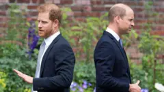 Britain's Prince Harry, Duke of Sussex (L) and Britain's Prince William, Duke of Cambridge attend the unveiling of a statue of their mother, Princess Diana at The Sunken Garden in Kensington Palace, London on July 1, 2021, which would have been her 60th birthday.