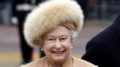 24/02/09 of Queen Elizabeth II in a fur coat, as she no longer uses fur in her outfits, having switched to fake fur this year,