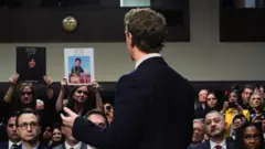 Meta's CEO Mark Zuckerberg stands and faces the audience as he testifies during the Senate Judiciary Committee hearing on online child sexual exploitation at the U.S. Capitol, in Washington, U.S., January 31, 2024.