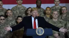 US President Donald Trump speaks to US troops during a surprise Thanksgiving visit to Afghanistan