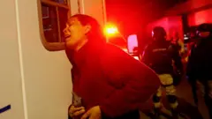 venezuelan migrant reacts