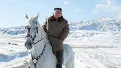 North Korean leader Kim Jong Un riding a white horse amongst the first snow at Mouth Paektu.