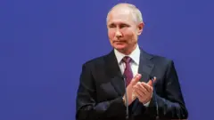 Путин