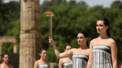 Actors play the role of priestesses and perform during the rehearsal of the Olympic flame lighting ceremony for the Paris 2024 Summer Olympic Games, at the Ancient Olympia site in Peloponnese, southern Greece,15 April 2024. The Lighting ceremony of the Olympic Flame, ahead of the XXXIII Summer Olympic Games 'Paris 2024' which will take place on 16 April 2024.