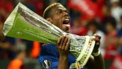 Manchester United's Paul Pogba with the Europa League trophy