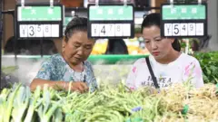 Citizens buy agricultural and sideline products in the supermarket poverty alleviation sales zone. Guiyang City, Guizhou Province, China, September 9, 2020.-