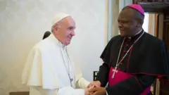 Papa Francis na Archibishop Besungu