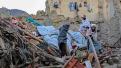 People affected by earthquake wait for relief in Gayan village in Paktia province, Afghanistan, 23 June 202