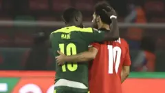 Senegal's Sadio Mane consoles Mohamed Salah after Egypt lose the 2021 Africa Cup of Nations final