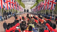 King Charles III and members of the royal family behind Queen Elizabeth II's flag-draped coffin as it is taken in procession on a Gun Carriage of The King's Troop Royal Horse Artillery from Buckingham Palace to Westminster Hall on 14 September 2022
