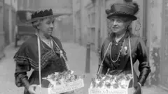 Lady Hanbury Williams and Mrs Schlater selling flags on Soldier's Day, 3 May 1917.