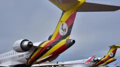 Bombardier CRJ900 planes with Ugandan flag and crest on them