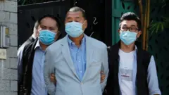 Media mogul Jimmy Lai Chee-ying, founder of Apple Daily (C) is detained by the national security unit in Hong Kong, China August 10, 2020