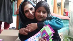 Irfana Zargar hugging a teenager who just got sanitary pads from her