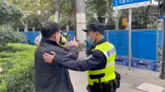 kina protest policija slikanje