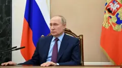 путін