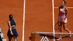 Marta Kostyuk walks to her chair without shaking Aryna Sabalenka's hand