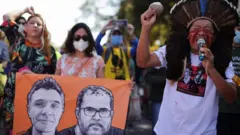 Kamuu Dan Wapichana, from the Wapichana tribe, sings during a protest to demand justice for journalist Dom Phillips and indigenous expert Bruno Pereira, who were murdered in the Amazon, in Brasilia, Brazil June 19, 2022.