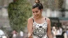 A woman keeping cool in London