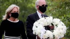 Democratic US presidential candidate and former vice-president Joe Biden and his wife Jill visit the War Memorial Plaza during Memorial Day, amid the outbreak of the coronavirus disease (Covid-19), 25 May 2020