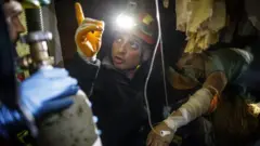 Firefighters trying to rescue a survivor after an earthquake hit Thumane, Albania, 26 November 2019