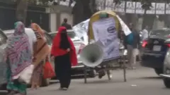কান ফাটানো উচ্চ শব্দে মাইক বাজিয়ে আবাসিক এলাকায় প্রচারণা।