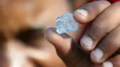 Man holding stone