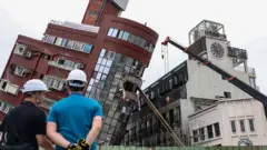 Heavy equipment is used to demolish the Uranus building, which was damaged in the April 3 earthquake, in Hualien on April 5, 2024