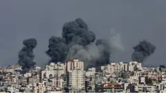 Smoke rises following Israeli strikes in Gaza, October 7, 2023