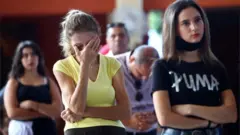 Worshippers at a church service in Beirut five days after a huge blast destroyed swathes of the city, 9 August 2020