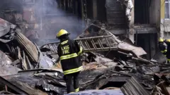 Lagos state fire fighter dey work for Balogun market fire on January 12 2019