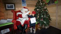A kid with santa