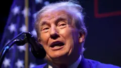Former US President Donald Trump dey tok for inside mic for one event for di Adler Theatre